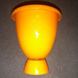 Orange glass vase decor piece.